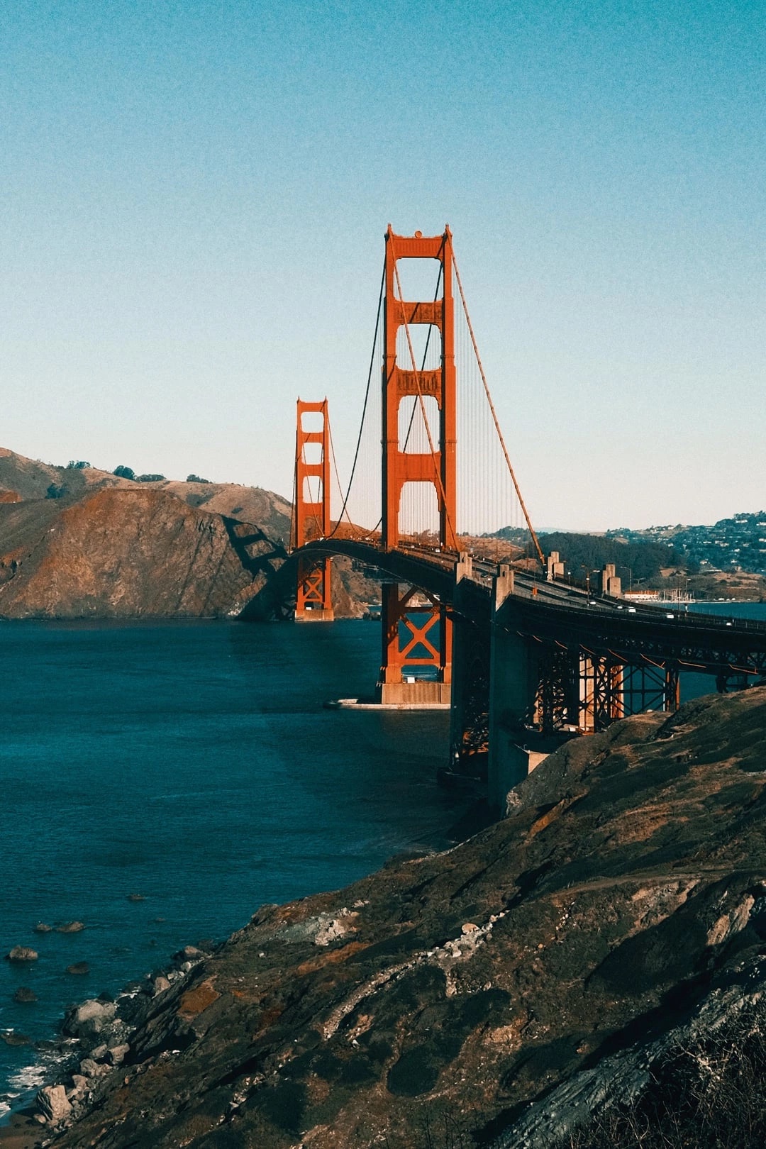 The Golden Gate Bridge over a deep-blue bay